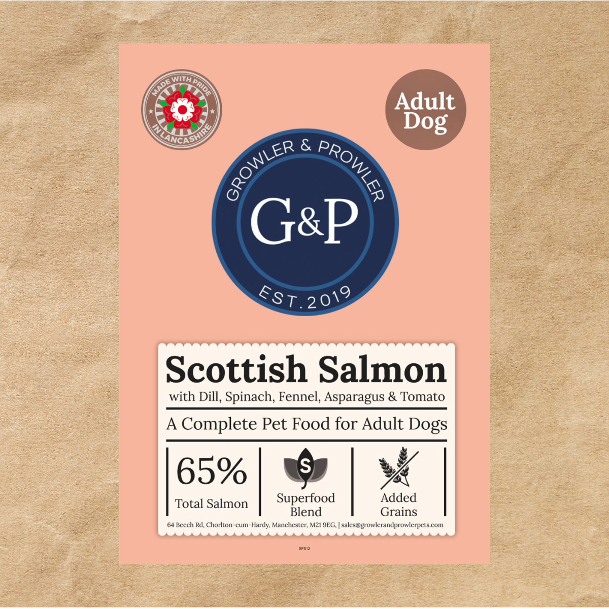  A brown paper bag of Growler & Prowler Scottish Salmon dog food. The bag features the company logo, information about the product, including the ingredients and nutritional content, and graphics of salmon, spinach, fennel, asparagus, and tomatoes.