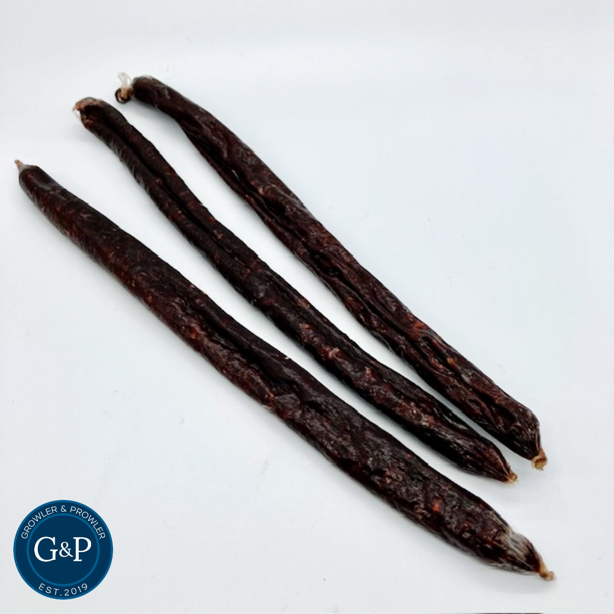 An appetising black pudding sausage for dogs. This natural dog treat from Growler and Prowler, a Manchester-based company, highlights wholesome ingredients suitable for canine health.