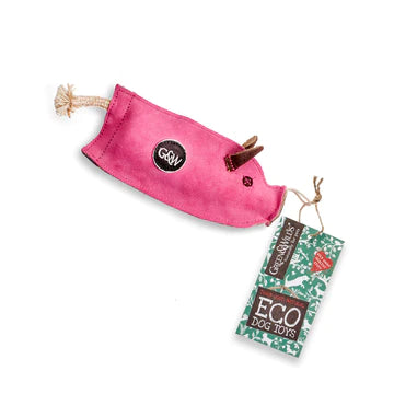 A pink, pig-shaped dog toy made from eco-friendly materials. The toy has a squeaker inside and a tag that says 'GREEN&WILD's ECO DOG TOYS'.