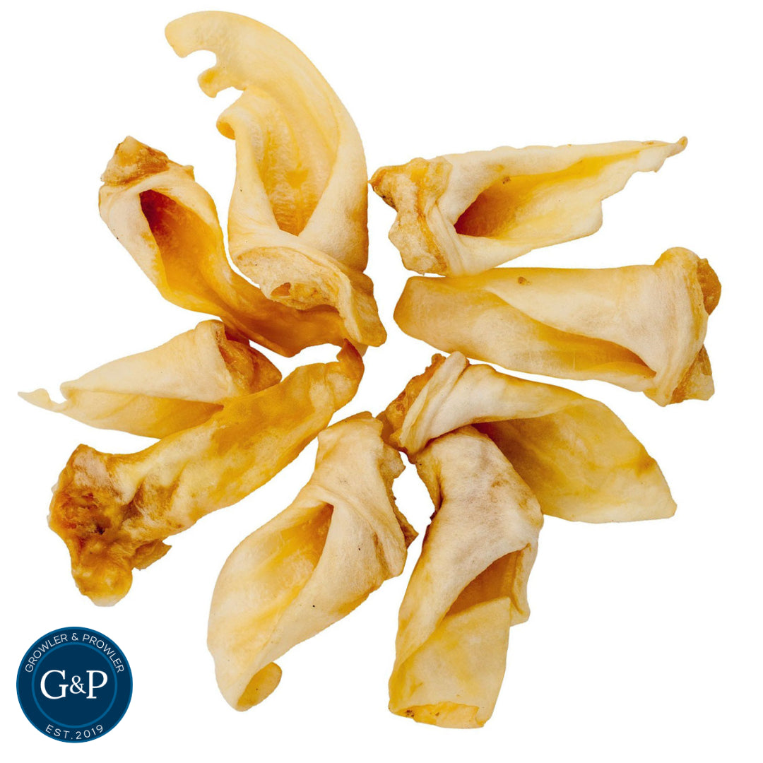 A circular arrangement of seven crispy, golden-brown lamb ears, perfect for dogs. The ears are arranged around a central tag with the Growler & Prowler logo and the text 'EST. 2019'