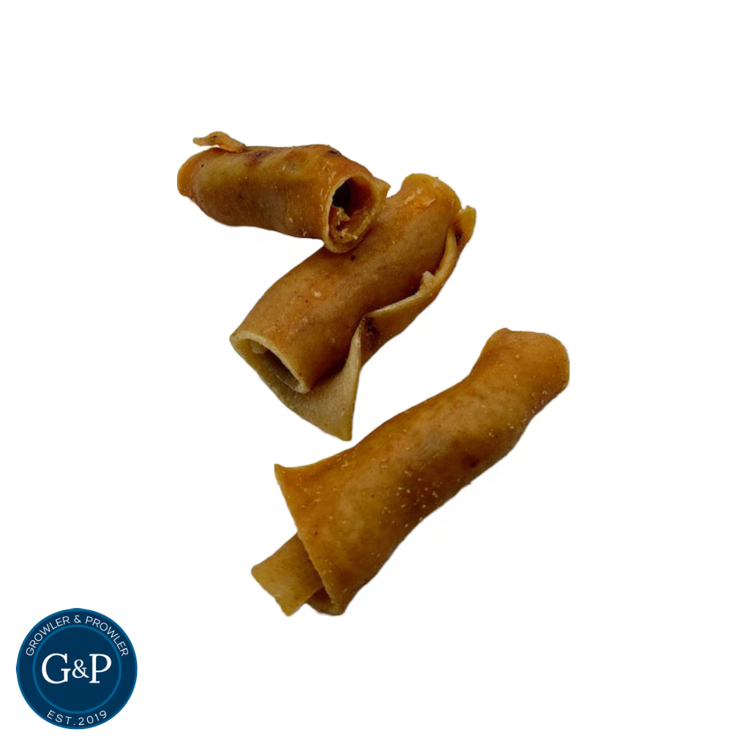 Gluten-free, air-dried mini sausage rolls for dogs, featuring a chewy pork rind casing and a flavourful chicken and pork filling. A nutritious and satisfying treat from Growler & Prowler.
