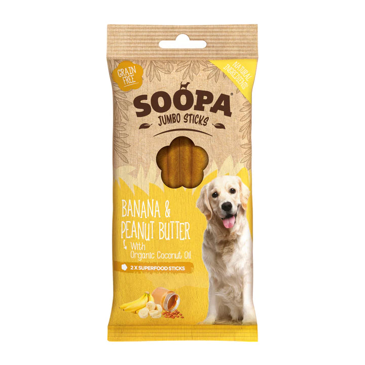 "A package of Soopa Jumbo Banana & Peanut Butter Sticks for dogs. The sticks are made with natural ingredients, organic coconut oil, and are grain-free. The package shows a dog holding one of the sticks, with bananas and a peanut butter jar in the background