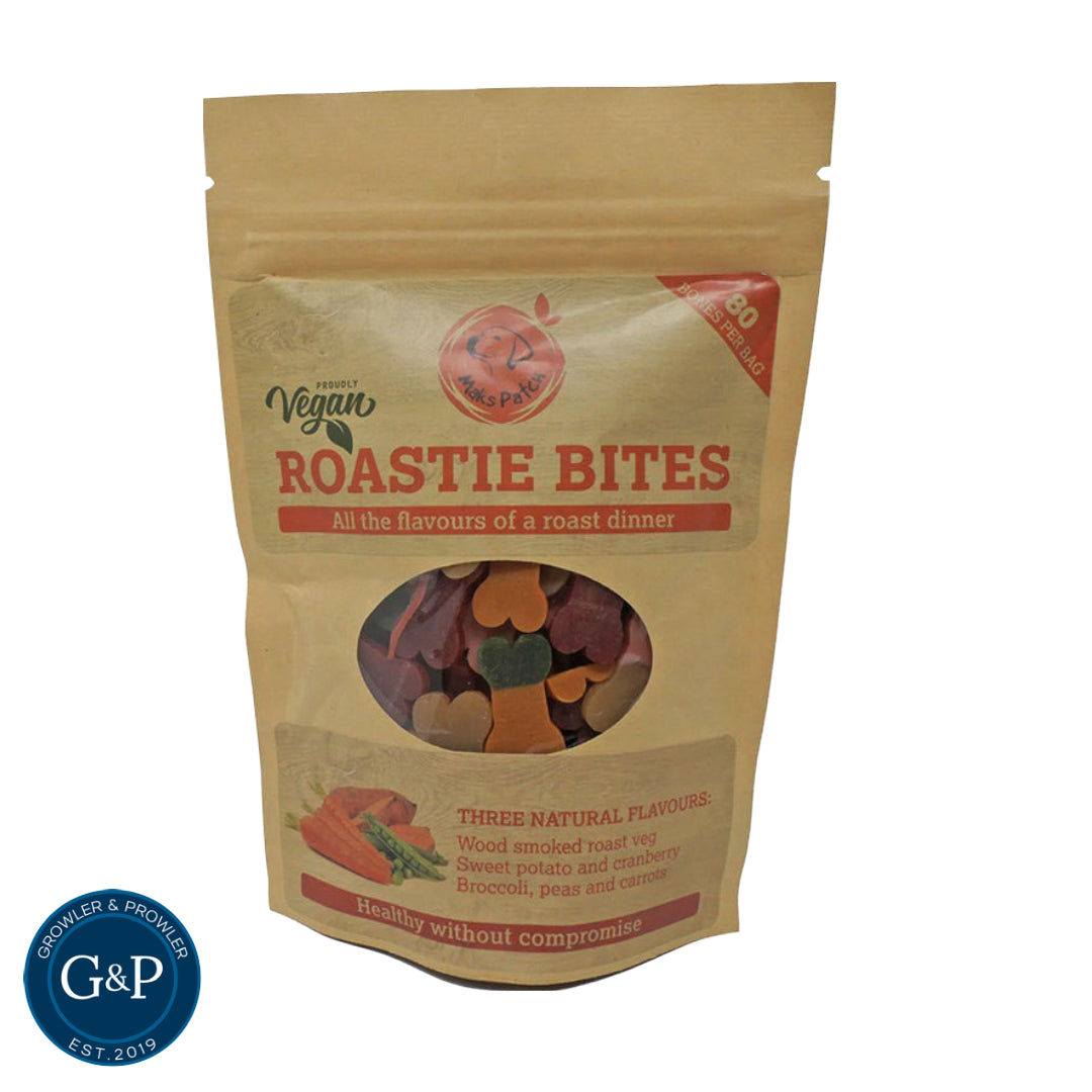 A bag of Maks Patch Vegan Roastie Bites dog treats. They are made with three natural flavours: wood-smoked roast veg, sweet potato and cranberry, and broccoli, peas, and carrot. They are also vegan and gluten-free